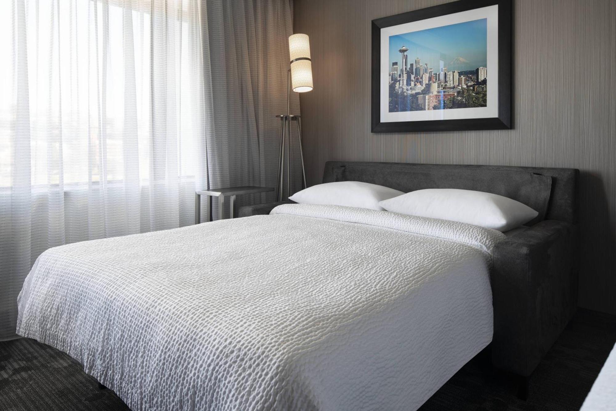 Kamer met Kingsize Bed en Slaapbank en Uitzicht op het Meer